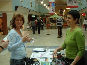 Discussing a vegan lifestyle at the Elated information table. Photo © Karen Johnson - The Elated Vegan.