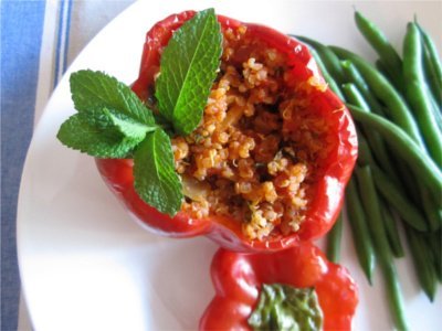 Quinoa-Stuffed Red Peppers deliciously flavoured with crunchy almonds and fresh mint. Photo © Angela from 'Vegangela'.